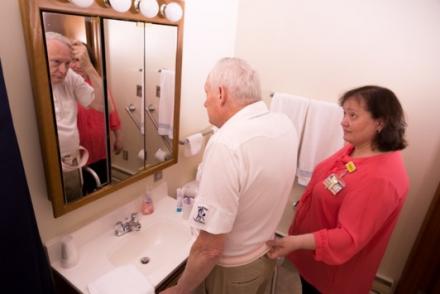 Donald and a nurse assess his bathroom safety.